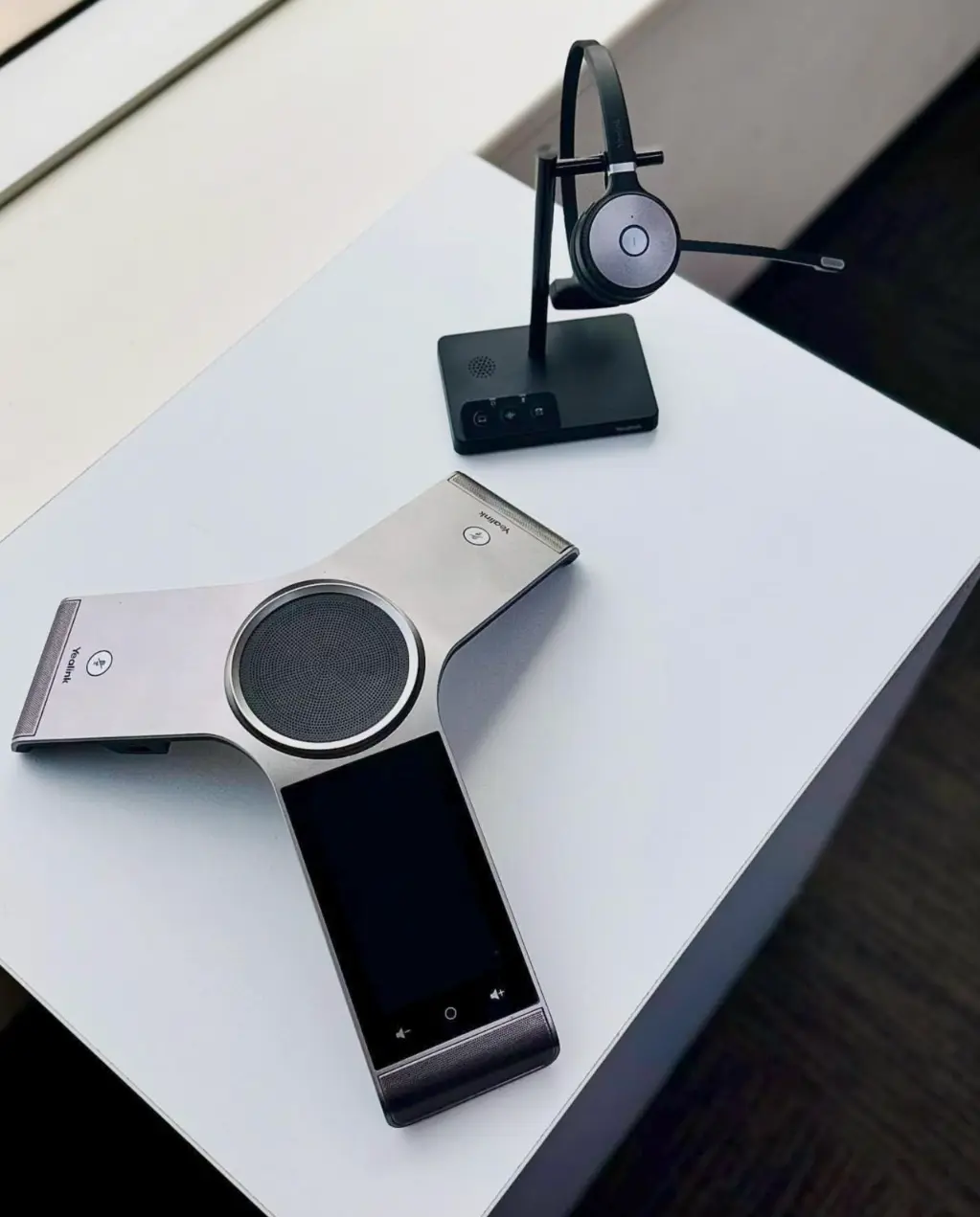 Office desk phones grouped together to represent a PBX business phone system for small business communication.
